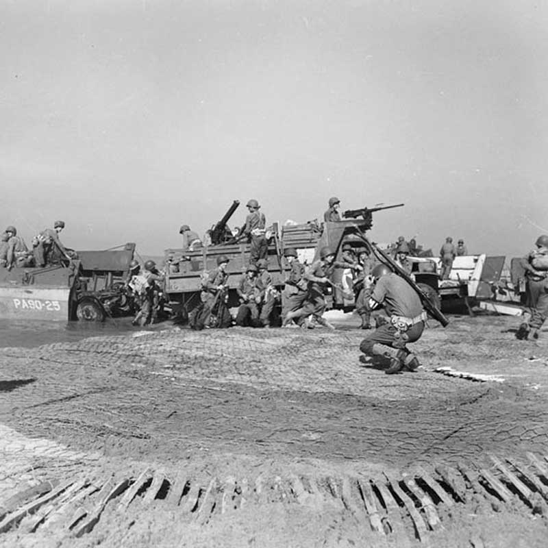 Artillery being landed during the invasion at Salerno